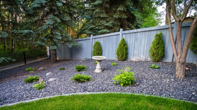 Planted garden with gravel and grass. Photo